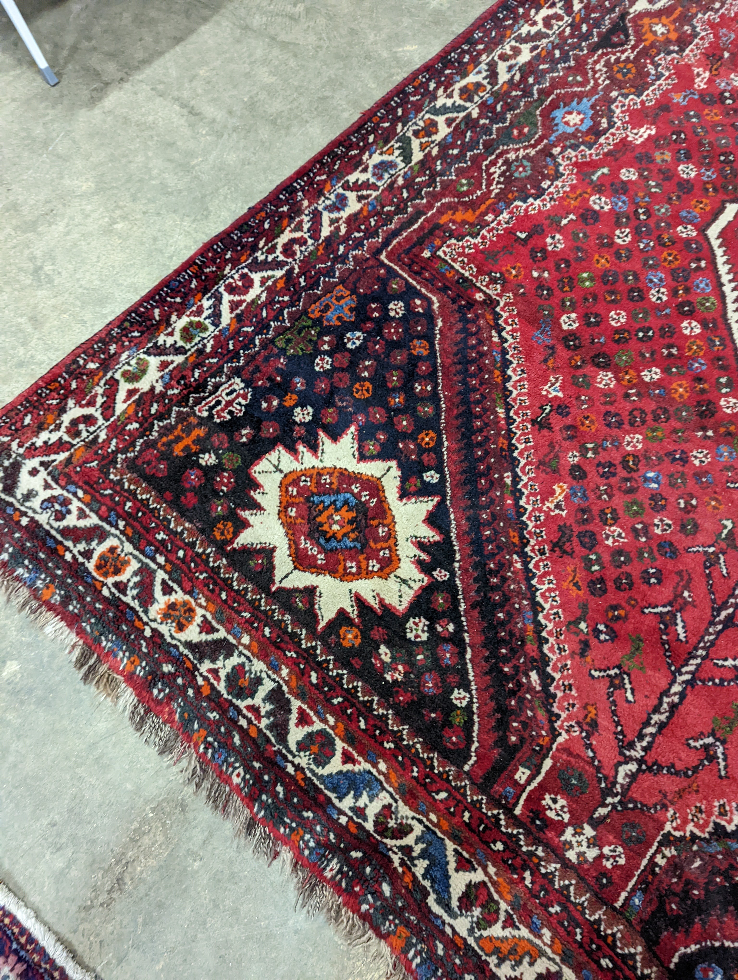 A North West Persian red ground carpet, 335 x 220cm